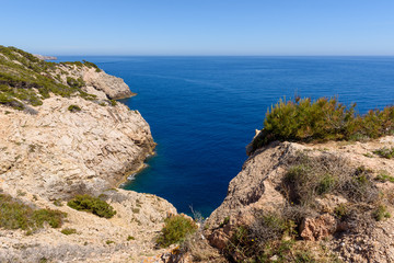 Rocky coast with blue sea. Cala Ratjada , north-east coast of Majorca. Spain