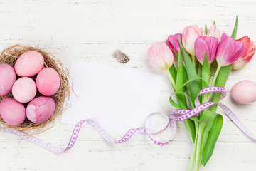 Easter greeting card with eggs and tulips