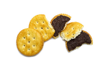 Biscuits some broken or crack of sandwich cracker chocolate cream flavoured. Crunchy delicious sweet meal and useful cookies. On white background.