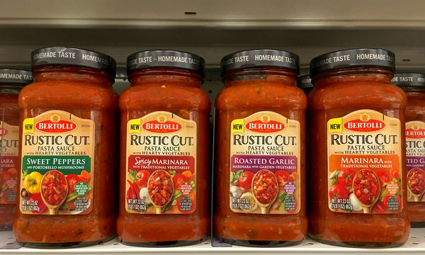 Alameda, CA - September 13, 2017: Grocery shelf with jars of Bertolli brand Rustic Cut Pasta Sauces. Known for its olive oil, Bertolli has widened its range to include pasta sauces and ready meals.