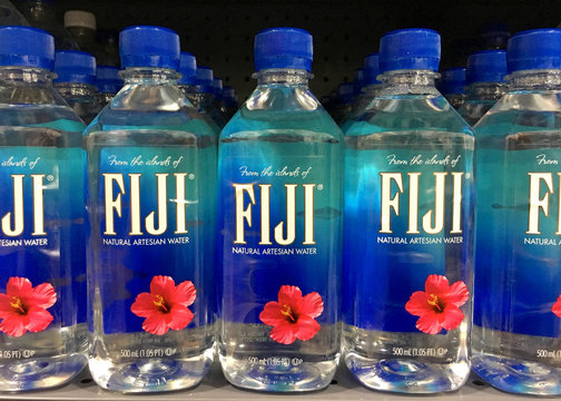 Anaheim, CA - September 29, 2017: Grocery store shelf with bottles of Fiji water. Fiji Water is a brand of bottled water derived, bottled, and shipped from Fiji