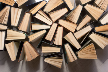 Stack of books background. many books piles. © Roman Motizov