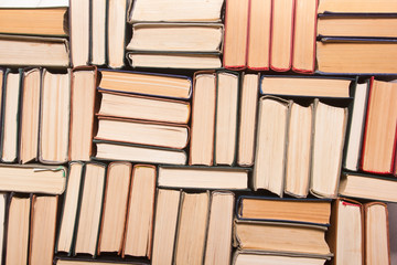 Stack of books background. many books piles. - 322594530