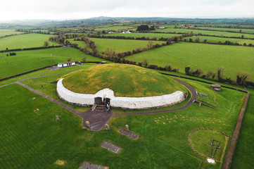 newgrange - old passage tomb in green field