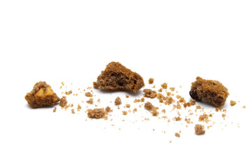 Crumbs of cookies with chocolate chip butter flavored on white background.