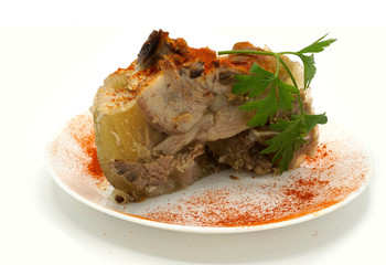 Traditional Romanian homemade pork trotter jelly dish called piftie. Jellied pork aspic made with pork meat served with paprika and fresh parsley.