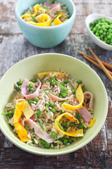 Chinese food. Cantonese fried rice with omelette, green peas and white ham in two bowls