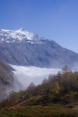 The clouds under the Rocciamelone Italy may look like a white river flowing among the mountains.