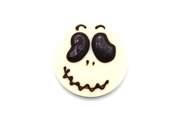 Cute Halloween gingerbread chocolate cookie treat isolated on white background. Homemade biscuit for holiday festival. Treats for party. Top view.