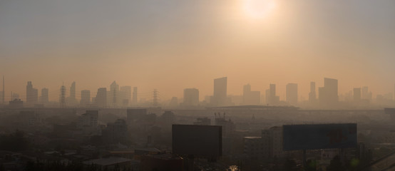 Panoramic of sun rise Bangkok city with a lot of PM2.5 dust in the morning  
