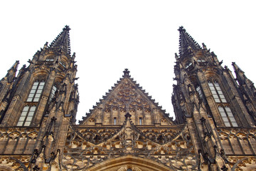 Fototapeta premium Prague. 05.10.2019: Perspective view of the Metropolitan Cathedral of Saints Vitus, Wenceslaus and Adalbert, an excellent example of Gothic architecture. Golden Gate South Tower with clock.