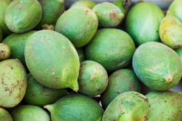 box full of green mangoes