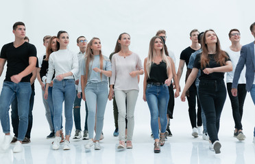 Obraz premium in full growth. confident young people stepping forward
