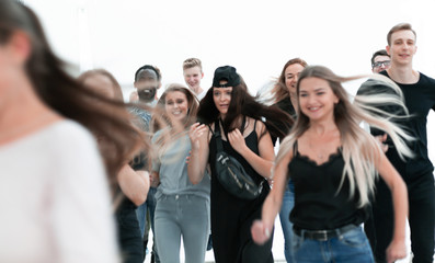 group of diverse young people hurrying towards their goal