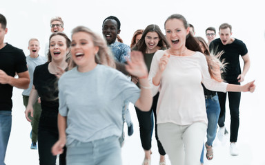 Fototapeta premium in full growth. smiling young people hurrying to their goal
