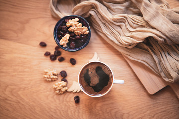 turkish coffee with dry berreis and walnut on wood table