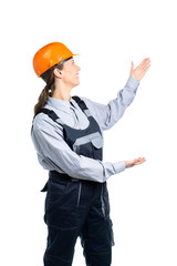 girl civil engineer shows to the side with hand gestures. Isolated