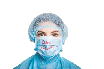Portrait of young woman wearing medical uniform and mask with China quarantine text isolated on white background. Protect your health. Coronavirus concept