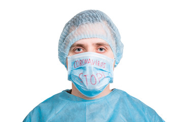 Portrait of ill man in medical unifrom and protective mask with stop coronavirus text isolated on white background. Respiratory protection. Coronavirus concept