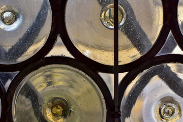 Close up of very old window made from glass and iron. Interesting close up, abstract photo.