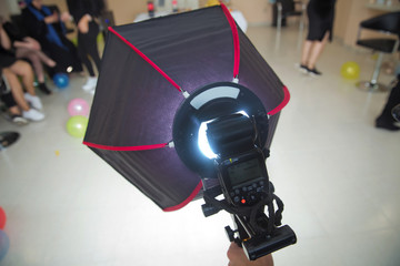 The birthday uses a soft-box for shooting . Soft-box Diffuser for Speed-light Speed-lite