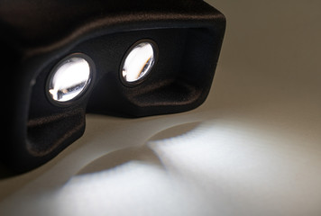 Virtual reality device on, casting light shadows.