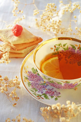 Fresh fragrant tea with lemon and homemade cookies.
