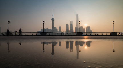 The blur effect of the people are walking in this area. And Shanghai Bund historical buildings old colonial buildings, Popular tourist destination, China.