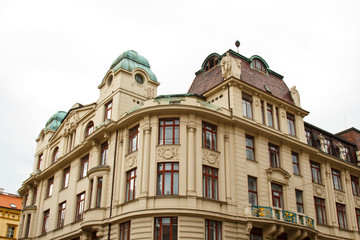 Obraz premium Prague, Czech Republic. 10.05.2019: Close-up view of the facade with windows of old historical buildings in Prague. Retro, old-fashioned, vintage, last century.