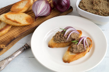 fried sausages with bacon on a plate