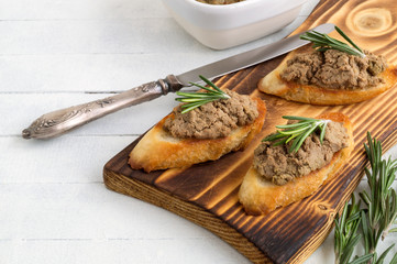 homemade meat pate on toasted crusty bread.