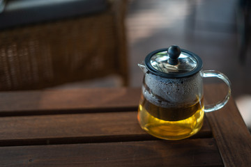 A teapot placed on a brown table