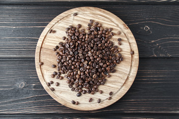 Coffee beans on the wooden tray floor