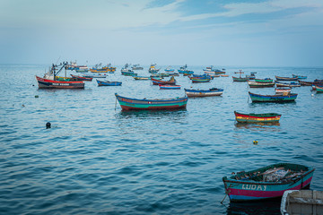 Obraz premium Artesanal fishing boats on the water early in the morning
