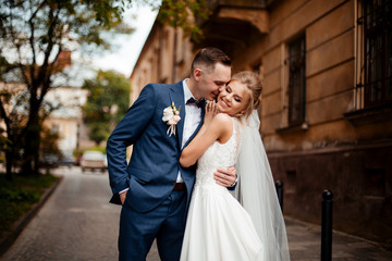 Fototapeta premium wedding day. brides kiss in love