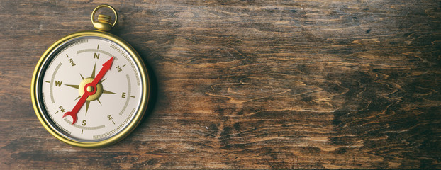 Compass instrument against wooden background. 3d illustration © Rawf8