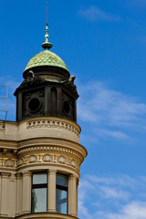 Fototapeta na wymiar Prague, Czech Republic. 10.05.2019: Close-up view of the facade with windows of old historical buildings in Prague. Retro, old-fashioned, vintage, last century.