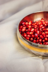 Pomegranate seeds in an iron plate