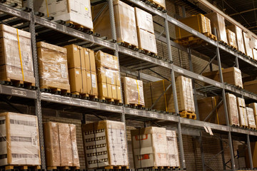racks with large boxes, storage warehouse. Room for storing parcels.