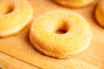 Donut with apple jam on the rustic background. Selective focus.