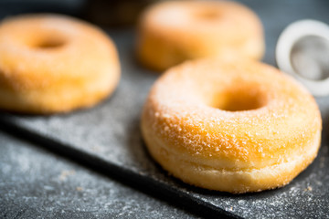 Donut with apple jam on the rustic background. Selective focus.