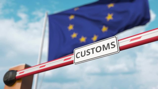Barrier gate with CUSTOMS sign being closed with flag of the EU as a background. European border closure or protective tariffs