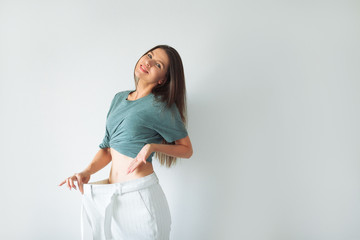 Woman Losing Weight After Diet, Slim Down, Burning Fat and Flat Waist. Thin Girl Show Weight Loss...