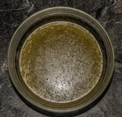 Making of marijuana butter with leafs and yellow butter which will be green