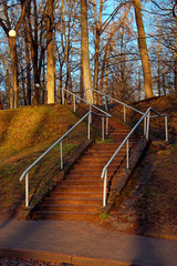 staircase with stone steps and metal handrails in the park