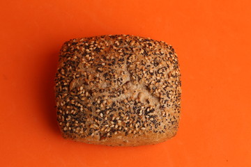 delicious bread rolls on colored background