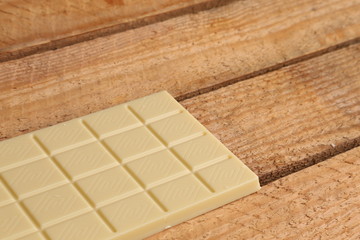 white chocolate tablet in color background