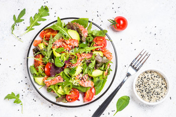 Salmon salad on white top view.