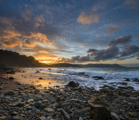 Golden Pebble Beach at Sunset