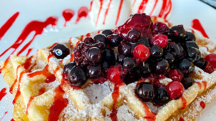 Belgian waffles with fresh berries and ice cream